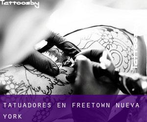 Tatuadores en Freetown (Nueva York)